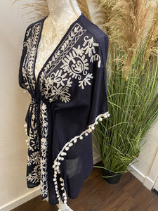 Kaftan With Floral Embroidered Neckline.